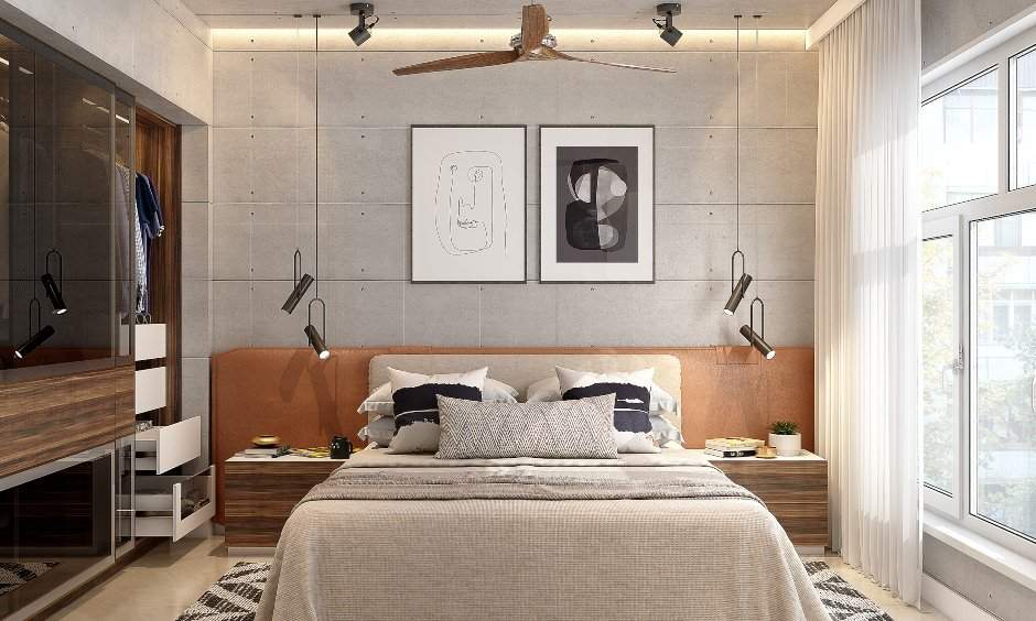 1 bhk flat bedroom designed with a bed, modular sliding wardrobe and wooden flooring