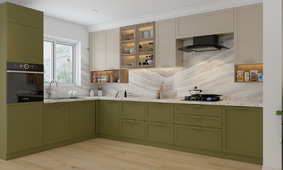 Cream, oak and sage green kitchen cabinets with marble backsplash, warm lighting and functional layout