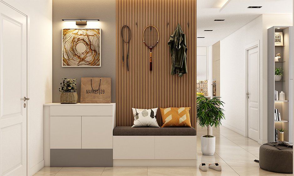 An entryway design tips to turn the space into a hobby nook by adding some hooks on the wall to place your rackets