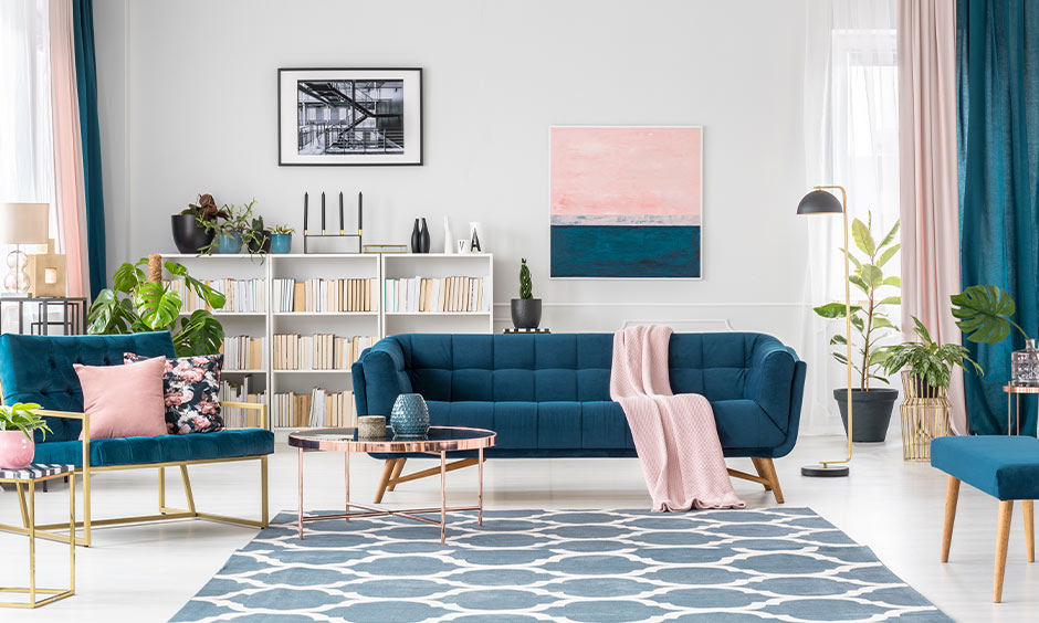 Floating sofa styled with console table, cushions and decor to enhance visual appeal.