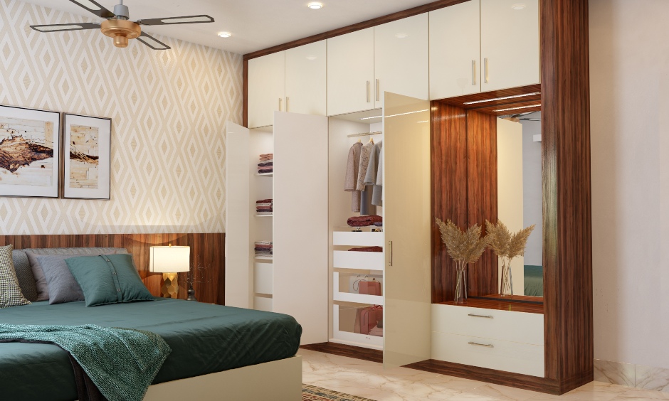 Frosty white and wood wardrobe has attached dressing unit and loft cabinets that provide more storage