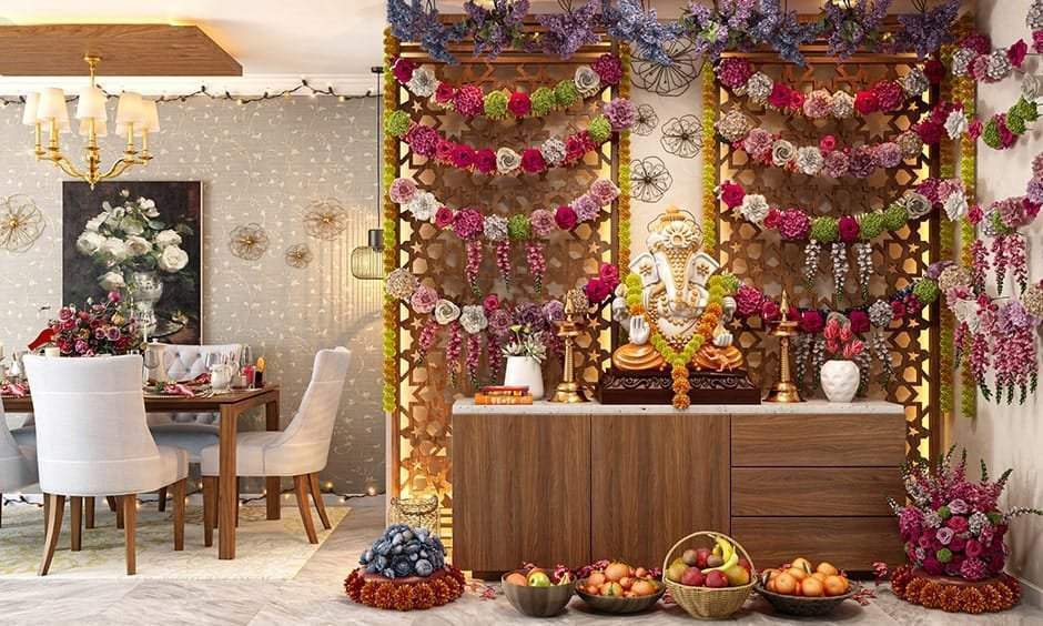 Simple decoration for ganesh chaturthi with colourful flower garlands and fruits, enhancing the mandap setting