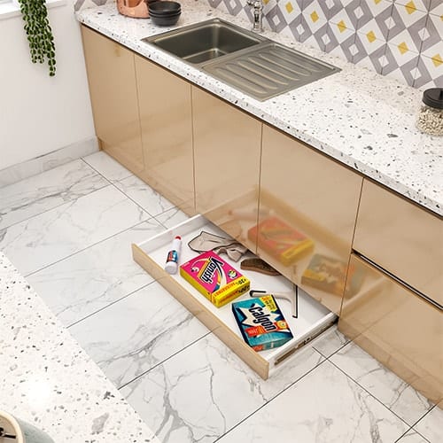 Home interior designer in Noida created a skirting drawer that utilizes the dead space