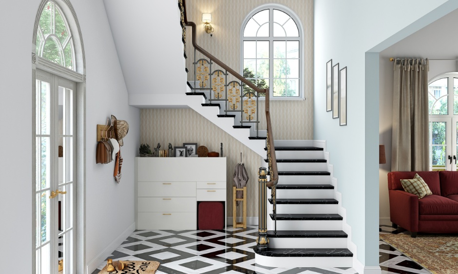 Classic staircase with black stone treads and wooden handrail showing durable materials for staircase designs for homes