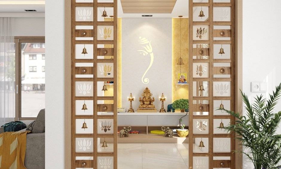 Open mandir pooja room design with Ganesh jaali cutout in the backdrop, painted limewash yellow on either side