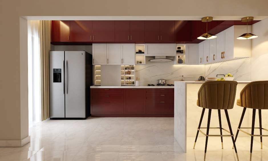 Red and white modular kitchen has breakfast counter with two bar stools