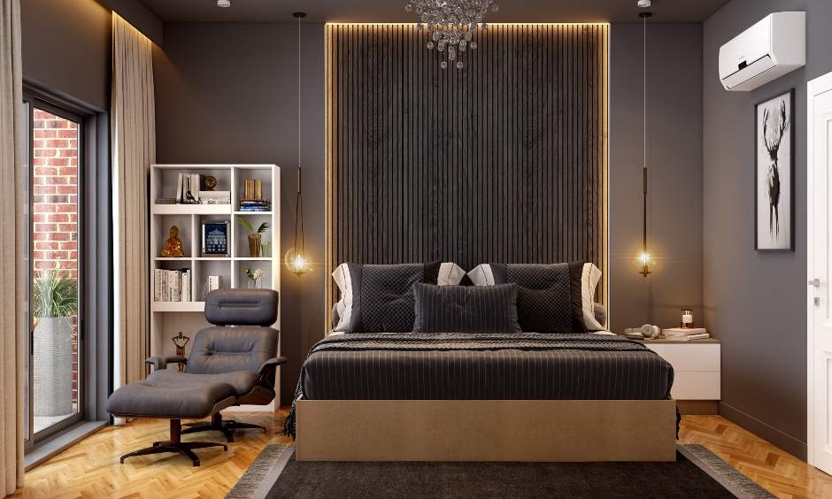 A spacious black bedroom with black wood paneling behind the bed lends luxury appeal