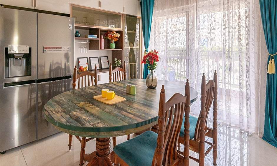 Traditional oval dining table and chair set with a twist to comfortably accommodate four people